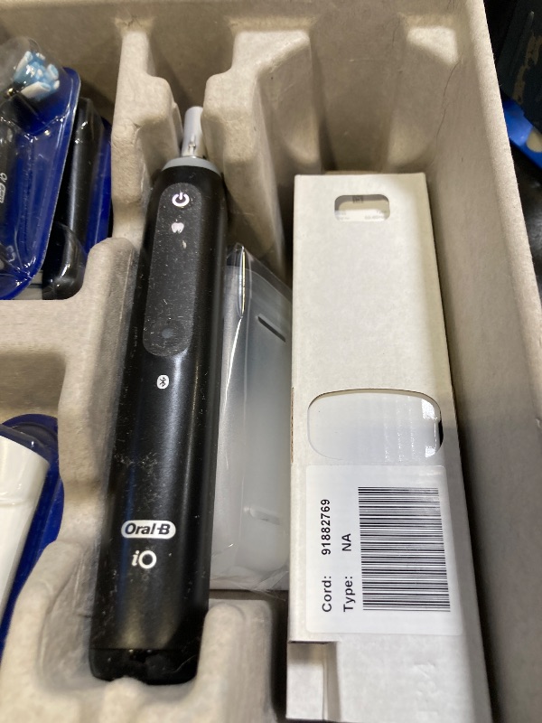 Photo 1 of Oral-B iO Deep Clean + Whiten Rechargeable Electric Toothbrush with Visible Pressure Sensor, 2 Minute Timer, 5 Cleaning Settings, 1 iO5 Limited, 3 Toothbrush Heads, Travel Case & Refill Holder, Black