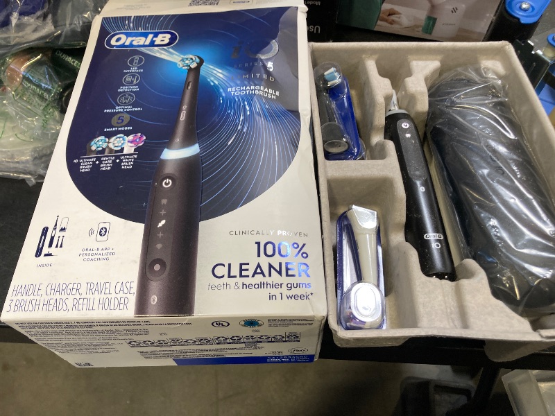 Photo 1 of Oral-B iO Deep Clean + Whiten Rechargeable Electric Toothbrush with Visible Pressure Sensor, 2 Minute Timer, 5 Cleaning Settings, 1 iO5 Limited, 3 Toothbrush Heads, Travel Case & Refill Holder, Black