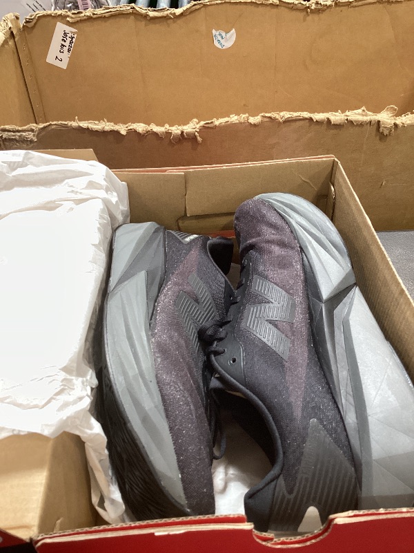 Photo 1 of New Balance Men's FuelCell Rebel V5 Running Shoe, Black/Castlerock/Silver Metallic, 10.5 W