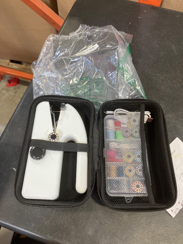 Photo 1 of Handheld Sewing Machine for Beginners, Mini Portable Electric Sewing Machine, Easy to Use, Fast Stitch for Fabrics & Clothes, Travel & DIY, Compact & Lightweight