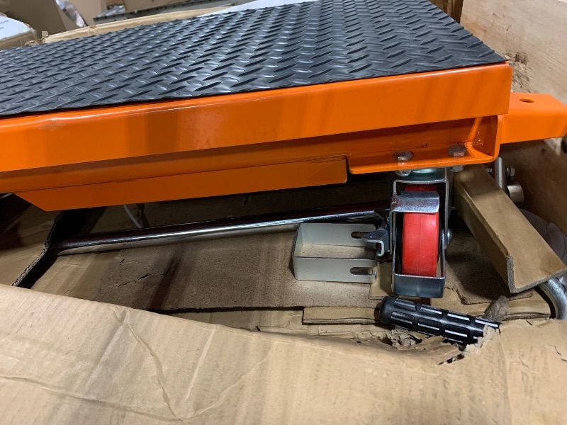 Photo 1 of ****It doesn't have a manual.***** VEVOR Hydraulic Lift Table Cart, 330lbs Load Capacity 50 Inch Lifting Height, Manual Single Scissor Lift Table with Non-Slip Pad and 4 Wheels, Hydraulic Scissor Cart for Material Handling, Orange