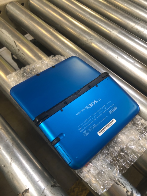 Photo 1 of Nintendo 3DS XL Handheld System - Black/Blue (Renewed) [Nintendo DS]