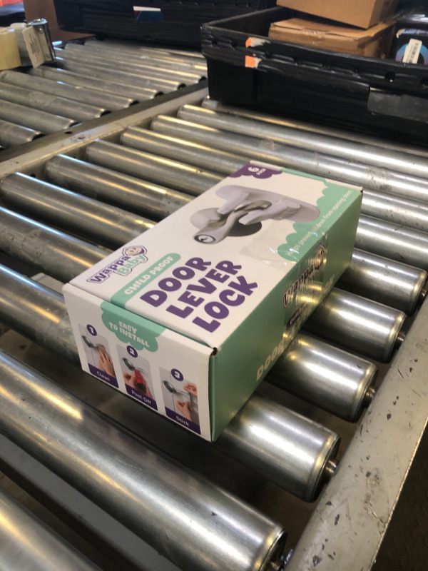 Photo 1 of Door Lever Lock (6 Pack) Prevents Toddlers from Opening Doors. 3.25" L * 1.5" W * 4.5" H Easy One Hand Operation for Adults. Durable ABS with 3M Adhesive Backing. Simple Install, No Tools Needed.
