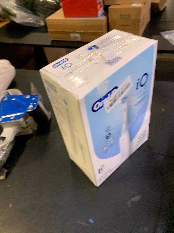 Photo 1 of Oral-B iO Deep Clean Rechargeable Electric Powered Toothbrush, White with iO Series 3 Limited, 2 Brush Heads and Travel Case - Pressure Sensor to Protect Gums - 3 Cleaning Settings - 2 Minute Timer