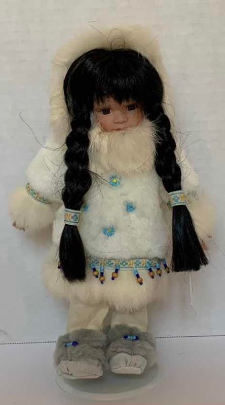 Photo 1 of PORCELAIN ESKIMO DOLL 11”H