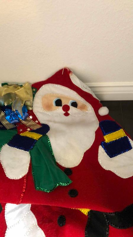 Photo 1 of CHRISTMAS WRAPPING AND A LARGE FELT SANTA CLAUS