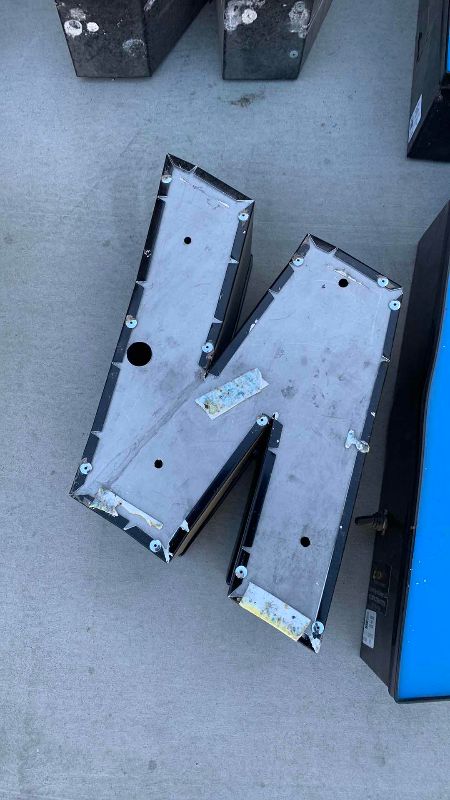 Photo 1 of METAL AND PLASTIC SIGN