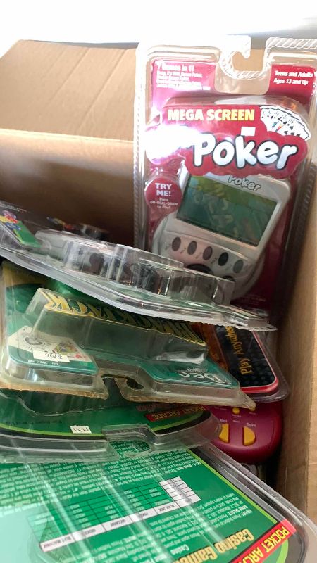 Photo 1 of BOX OF HANDHELD TOYS