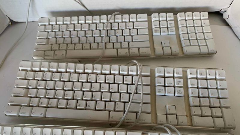 Photo 1 of APPLE KEYBOARDS AND POWER SUPPLY