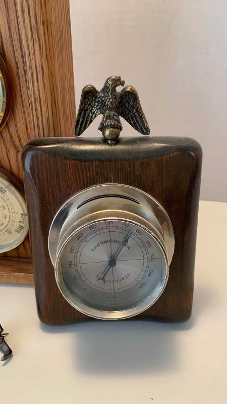 Photo 1 of VINTAGE OAKWOOD THREE DOLLAR WALL WEATHER STATION AND UNITED STATES INSPIRED THE THERMOMETER