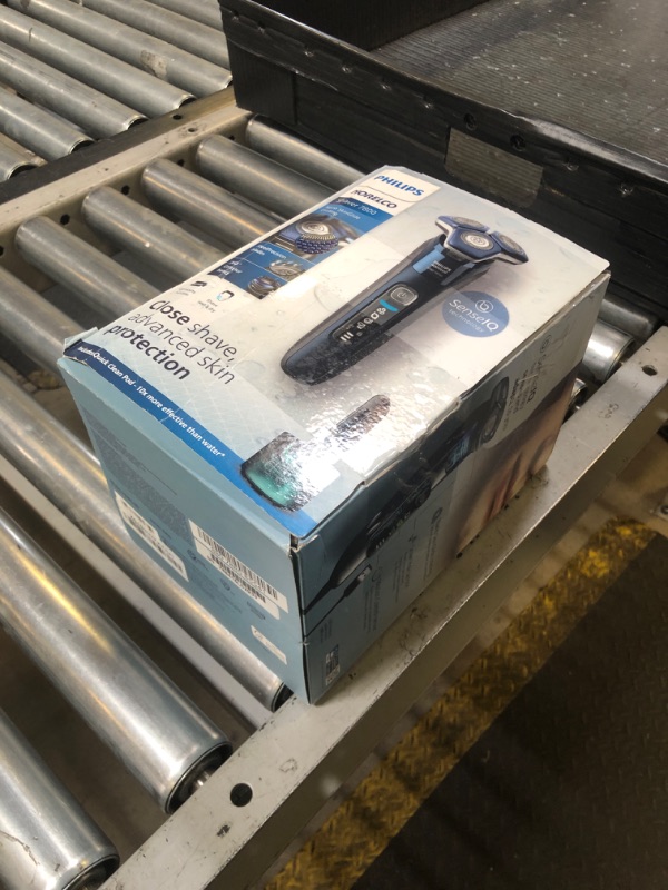 Photo 1 of Philips Norelco Shaver 7800, Rechargeable Wet & Dry Electric Shaver with SenseIQ Technology, Quick Clean Pod, Charging Stand, Travel Case and Pop-up Trimmer, S7885/85