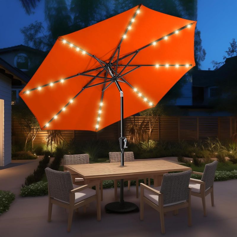 Photo 1 of HOMSHADE 9ft Solar Patio Umbrella - Solar Lights LED Lighted Outdoor Market Table Umbrella, UPF50+ UV Protection with Push Button Tilt, Crank for Pool Deck and Garden (Neon Orange)