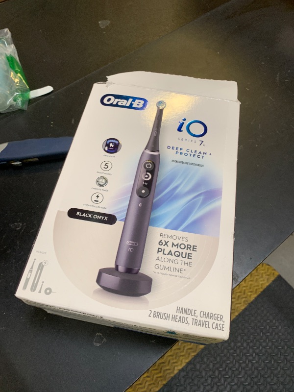 Photo 1 of Oral-B iO Deep Clean + Protect Rechargeable Electric Toothbrush, Black with a iO Series 7 Toothbrush, 2 Replacement Brush Heads, and a Charging Travel Case