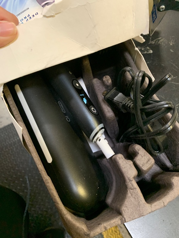 Photo 1 of Oral-B iO Deep Clean + Protect Rechargeable Electric Toothbrush, Black with a iO Series 7 Toothbrush, 2 Replacement Brush Heads, and a Charging Travel Case