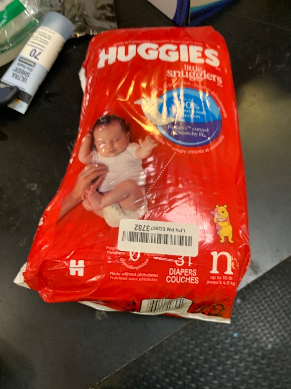 Photo 1 of Huggies Size Newborn Diapers, Little Snugglers Baby Diapers, Size Newborn (up to 10 lbs), 31 Count, Packaging May Vary