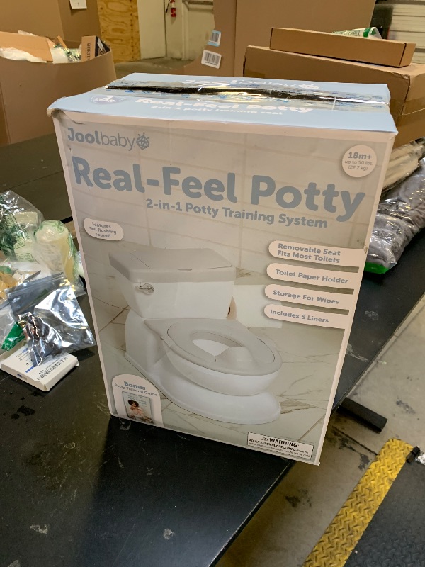 Photo 1 of Real Feel 2-in-1 Potty with Wipes Storage, Flushing Sounds & Disposable Liners - Realistic Toilet - Easy to Clean & Assemble - Jool Baby (Gray)