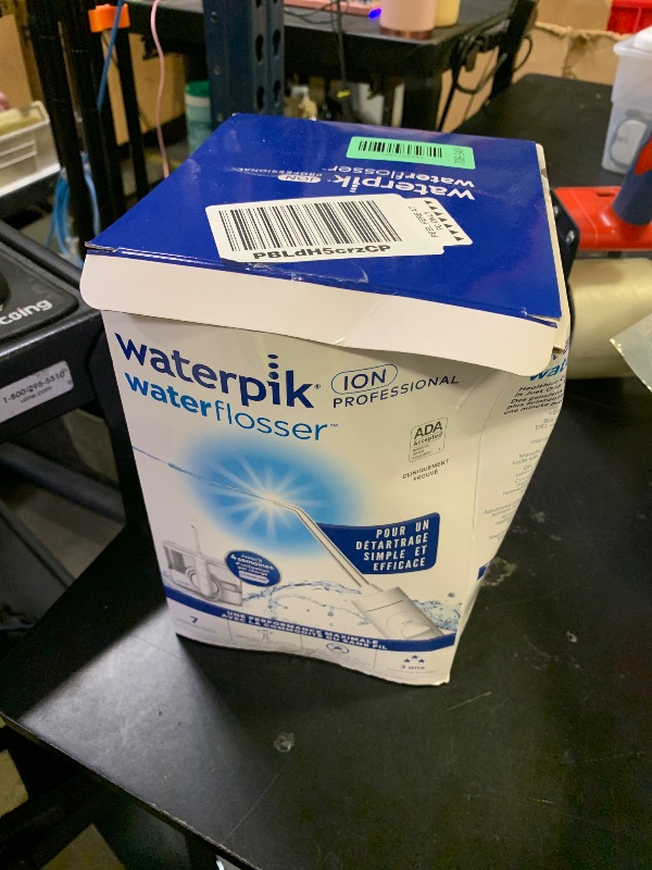 Photo 1 of Waterpik ION Professional Water Flosser, Rechargeable and Portable for Teeth, Gums, Braces, 10 Settings, 7 Flossing Tips For Multiple Users And Needs, ADA Accepted, WF-12 White, Packaging May Vary