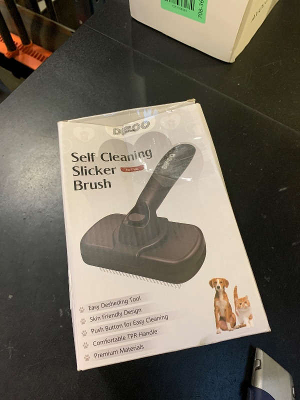 Photo 1 of Dipoo Self Cleaning Shedding Brush - Skin Friendly Grooming Tool for Dogs, Cats, and Puppies, Deshedding and Hair Removal for Long and Short Haired Pets, Black
