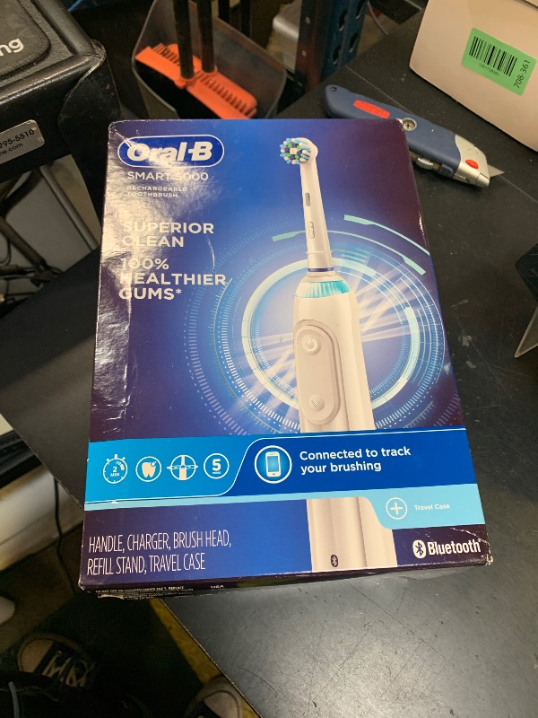 Photo 1 of Oral-B Smart 5000 Rechargeable Electric Powered Toothbrush, Black with Travel Case and Bluetooth - Visible Pressure Sensor to Protect Gums - 5 Cleaning Modes - 2 Minute Timer