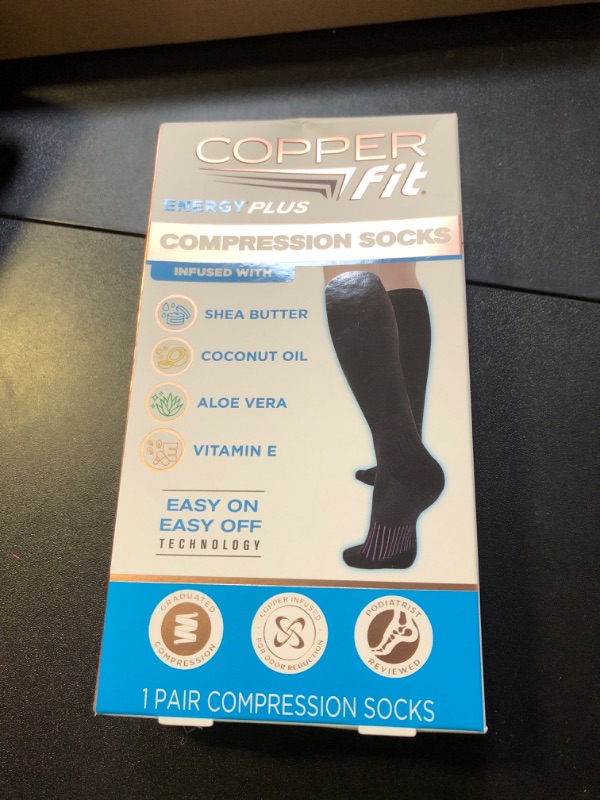 Photo 1 of Copper Fit unisex adult Moisturizing Energy Plus Easy On Easy Off Knee High Compression Socks, Black, Large-X-Large US