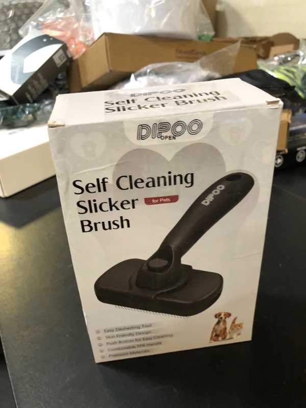 Photo 1 of Dipoo Self Cleaning Shedding Brush - Skin Friendly Grooming Tool for Dogs, Cats, and Puppies, Deshedding and Hair Removal for Long and Short Haired Pets, Black