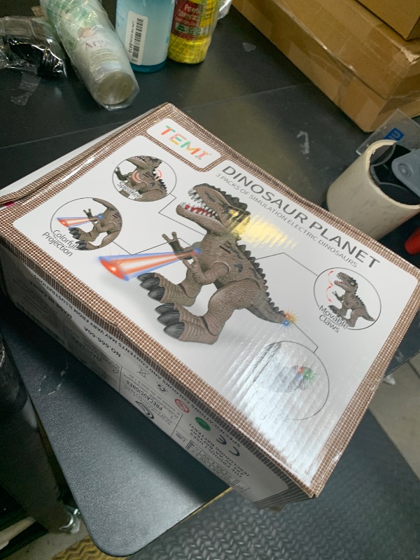 Photo 1 of TEMI 3 Pack Electrical Walking Dinosaur Toys for Toddlers 2-4 3-5 Years with Sound and Light Up, Toddler Robot Dinosaur, Brachiosaurus, Stegosaurus Dinosaur Figures for Kids