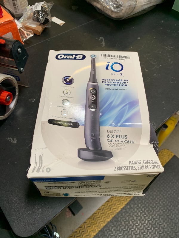 Photo 1 of Oral-B iO Deep Clean + Protect Rechargeable Electric Toothbrush, Black with a iO Series 7 Toothbrush, 2 Replacement Brush Heads, and a Charging Travel Case