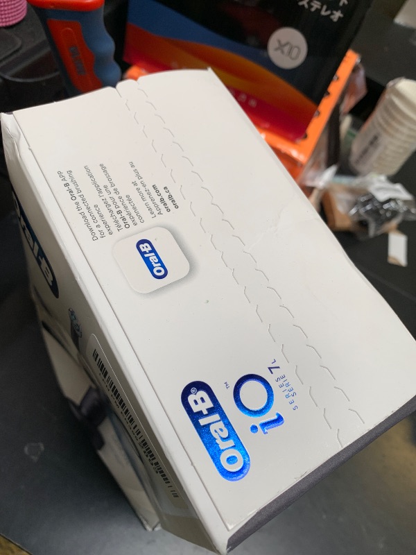 Photo 1 of Oral-B iO Deep Clean + Protect Rechargeable Electric Toothbrush, Black with a iO Series 7 Toothbrush, 2 Replacement Brush Heads, and a Charging Travel Case
