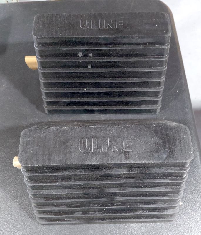 Photo 1 of 2 BOXES OF 2 NEW WHEEL CHOCKS - BLACK RUBBER, 9 3?4 X 8 X 6" ULINE H-517