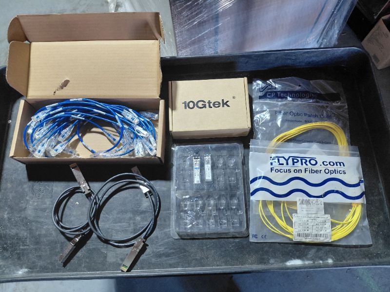 Photo 1 of CONTENTS OF TOTE- NETWORKING CABLES AND ADAPTERS