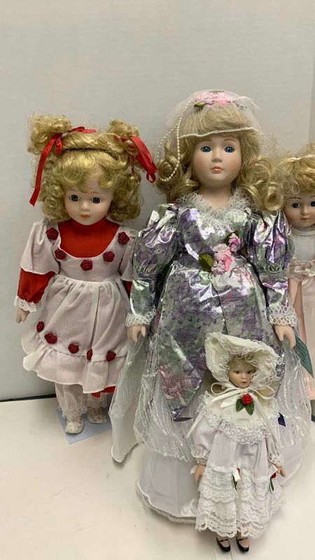 Photo 1 of 4-PORCELAIN DOLLS TALLEST IS 19”