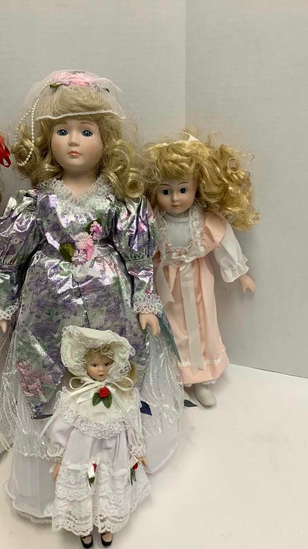 Photo 1 of 4-PORCELAIN DOLLS TALLEST IS 19”