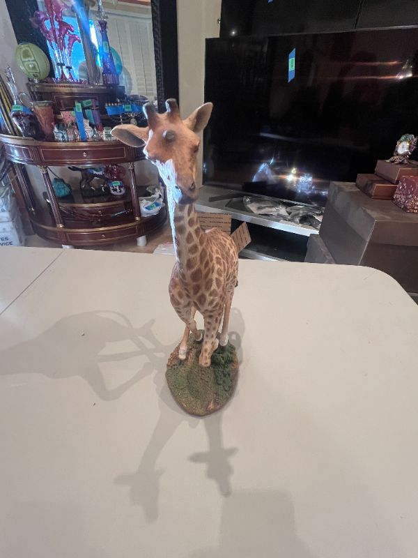 Photo 1 of CREART RESIN GIRAFFE RUNNING ON GRASS 15”H X 7”W