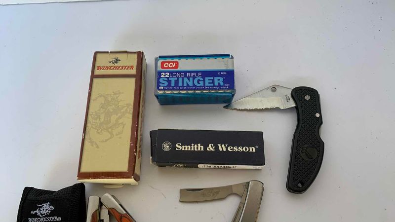 Photo 1 of 3 KNIVES AND .22 SHELLS WINCHESTER SMITH AND WESSON