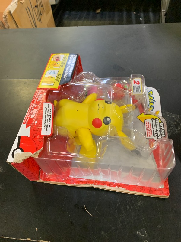 Photo 1 of Pokémon Train and Play Deluxe Pikachu - 4.5-Inch Pikachu Figure with Lights, Sounds, and Moving Limbs Plus Interactive Accessories