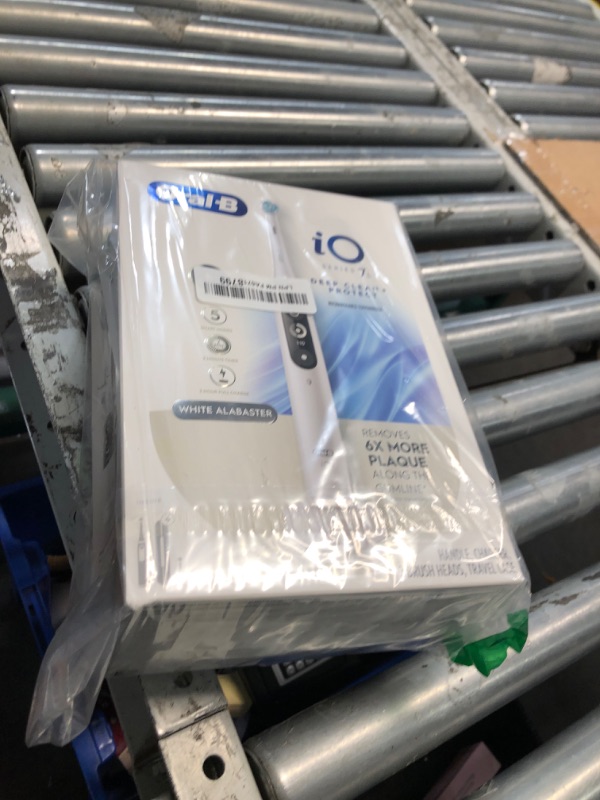 Photo 1 of (used)(minor damage) Oral-B iO Deep Clean + Protect Rechargeable Electric Toothbrush, White with a iO Series 7 Toothbrush