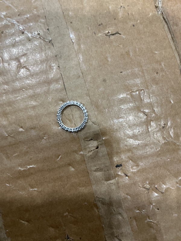 Photo 1 of ***MISSING ONE STONE*** Amazon Essentials Platinum-Plated Sterling Silver All-Around Band Ring set with Round Infinite Elements Cubic Zirconia (1 cttw), Size 8