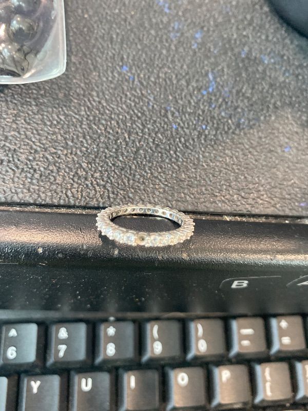 Photo 1 of ***MISSING ONE STONE*** Amazon Essentials Platinum-Plated Sterling Silver All-Around Band Ring set with Round Infinite Elements Cubic Zirconia (1 cttw), Size 8