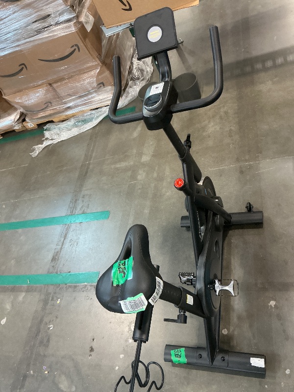 Photo 1 of **MAJOR DAMAGE**
Merach Exercise Bike, Brake Pad/Magnetic Stationary Bike with Exclusive App, Low Noise Indoor Cycling Bike with 270LBS Weight Capacity, Dumbbell Rack and Fitness Courses for Weight Loss