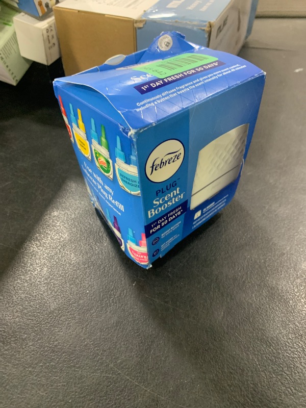 Photo 1 of Febreze Plug Scent Booster Continuous Scent Device Oil Diffuser, Compatible with Febreze Air Freshener Plug in Refills