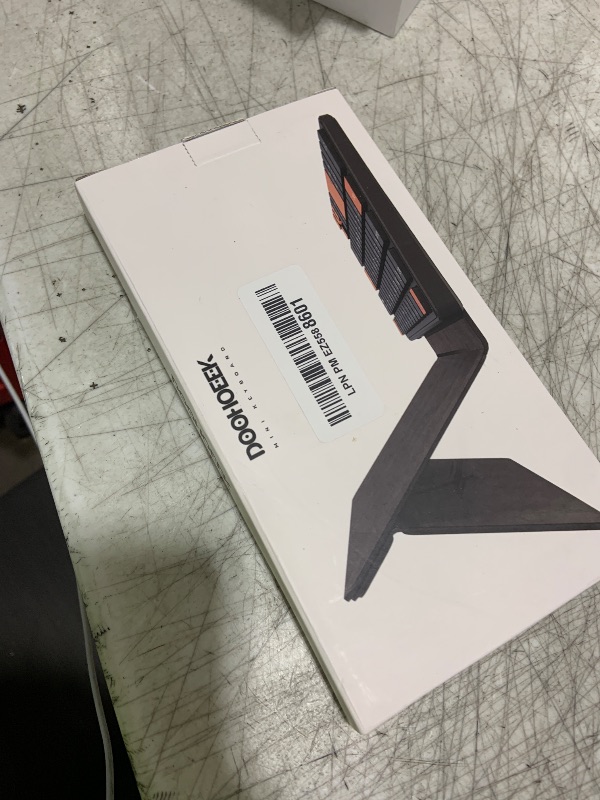Photo 1 of Doohoeek Universal Bluetooth Mini Keyboard, Wireless Compact Keyboard with Orange Navigation Keys & Any-Angle Stand for Android/iOS/Windows, Dual-Device Keypad for Phones/Galaxy Z Fold/iPad mini