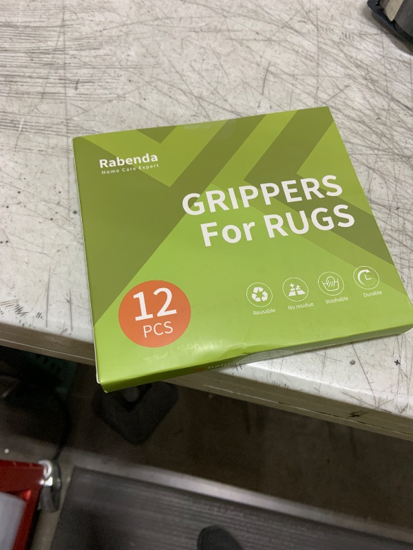 Photo 1 of Rabenda 12 Pcs Rug Tape, Non Slip Rug Pads Grippers for Hardwood Floors and Tiles, Reusable Carpet Tape for Area Rugs, Double-Sided Adhesive Rug Stickers Keep Corners Flat (Black)