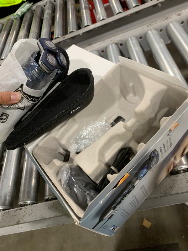 Photo 1 of Philips Norelco Shaver 7800, Rechargeable Wet & Dry Electric Shaver with SenseIQ Technology, Quick Clean Pod, Charging Stand, Travel Case and Pop-up Trimmer, S7885/85
