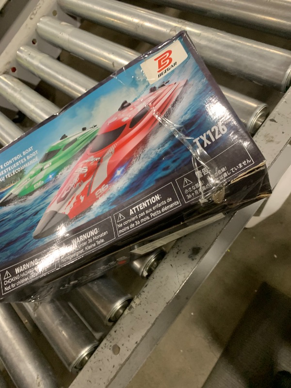 Photo 1 of BEZGAR RC Boat, 12 inch Remote Control Boat for Kids and Adults, 25 KPH Fast RC Speed Boats with 700mAh Battery, Ideal Waterproof Toy Boats for Lakes & Pools - TX126 Red