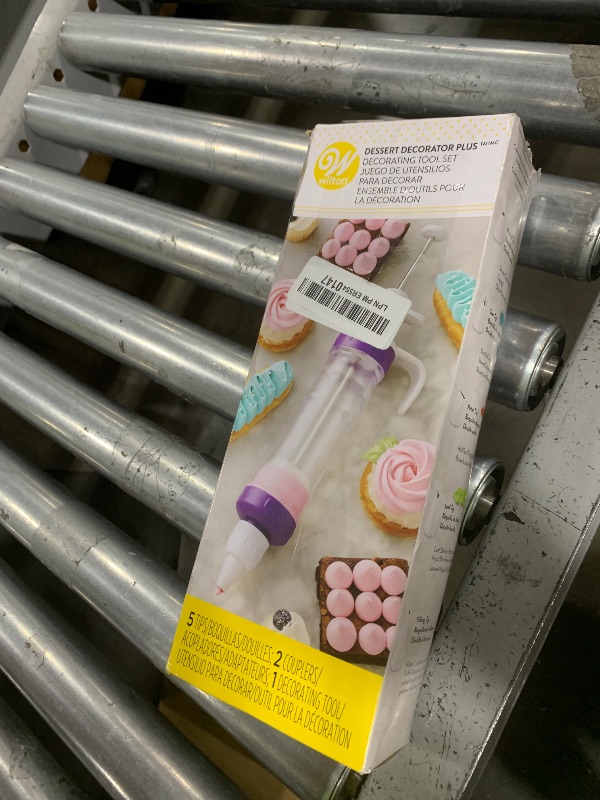 Photo 1 of Wilton Dessert Decorator - The Kit Includes a Plunger-Style Tool, 2 Couplers, 1 Fill Tip, 4 Decorating Tips, Plastic, White & Purple
