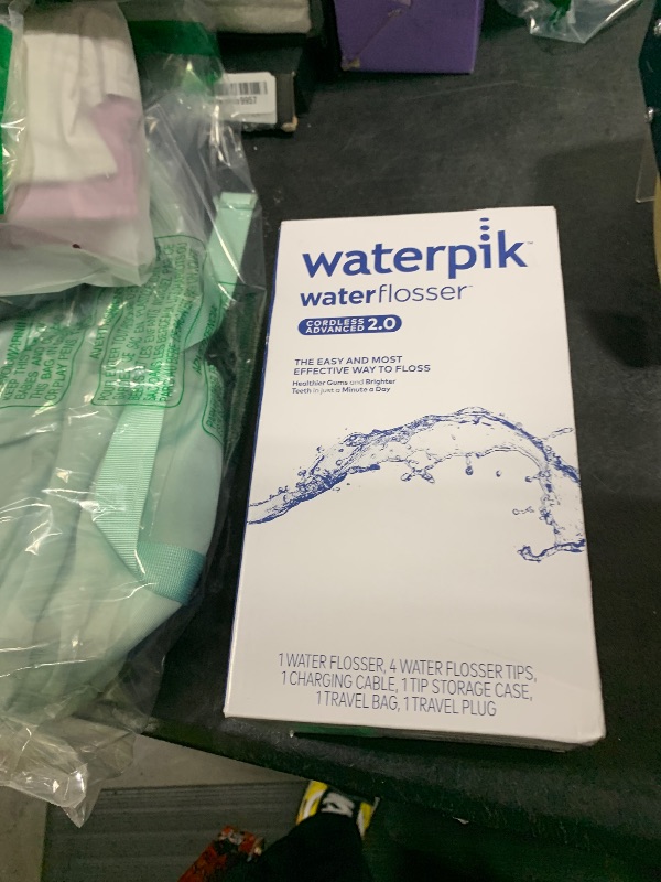 Photo 1 of Waterpik Cordless Advanced 2.0 Water Flosser For Teeth, Gums, Braces, Dental Care With Travel Bag and 4 Tips, ADA Accepted, Rechargeable, Portable, and Waterproof, White WP-580, Packaging May Vary