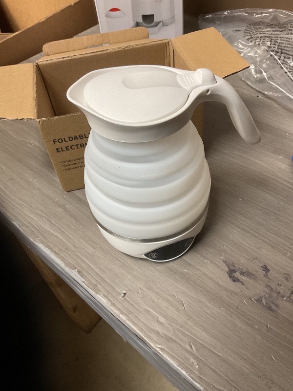 Photo 1 of PARTS ONLY ---------------------------------------------------------Collapsible Electric Travel Kettle, Portable Foldable Kettle for Boiling Water, Small Electric Kettles, Food-grade BPA Free Silicone, Suitable for 110V & 220V Dual Voltage, 850W (Pure Whi