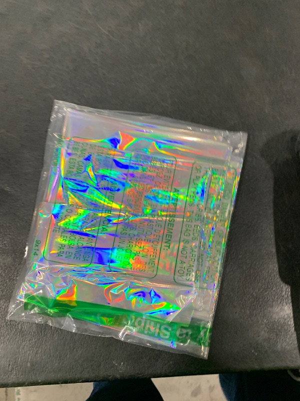Photo 1 of FunnyPars 4 Pack Iridescent Plastic Tablecloths Shiny Disposable Laser Rectangle Table Covers Holographic Foil Tablecloth Iridescent Party Decoration