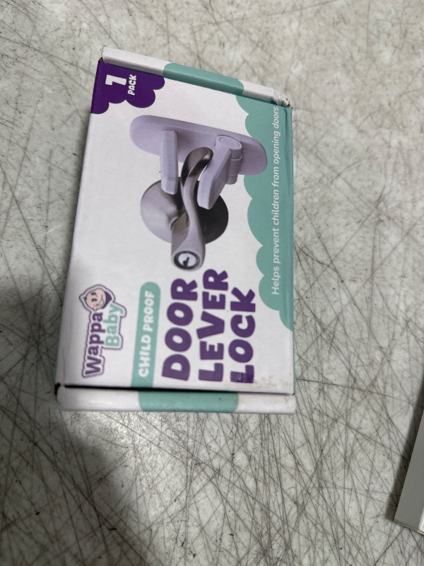Photo 1 of Door Lever Lock (1 Pack) Prevents Toddlers from Opening Doors. 3.25" L * 1.5" W * 4.5" H Easy One Hand Operation for Adults. Durable ABS with 3M Adhesive Backing. Simple Install, No Tools Needed.