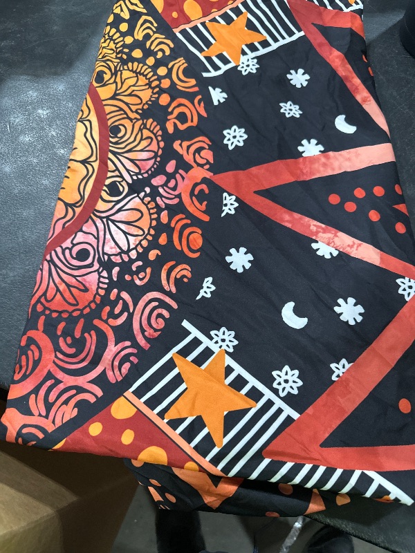 Photo 1 of table cloth 
orange and black design 